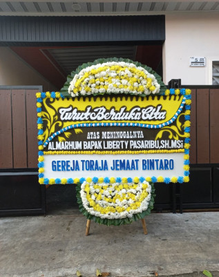 Papan Bunga Duka di Warsa